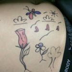 Tummy tuck and tattoo on stomach